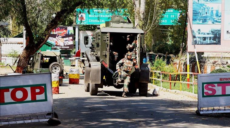 Uri: Army personnel in action inside the Army Brigade camp during a terror attack in Uri, Jammu and Kashmir on Sunday. PTI Photo (PTI9_18_2016_000084B)